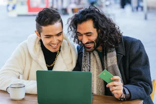 hand putting money in bucket